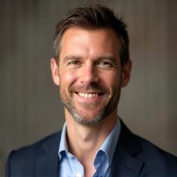 Professional headshot of Mark Anthony, a friendly man